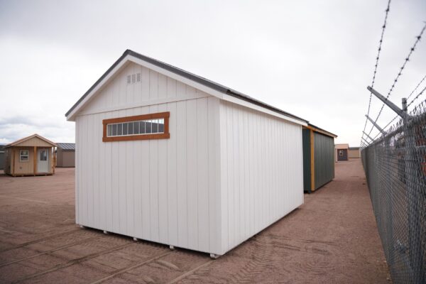 A view of the side of a 12x16 Studio Gable storage shed.