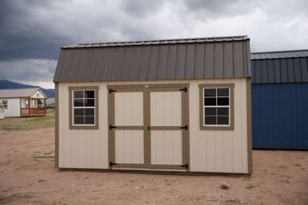 10x16 Barn Style storage shed with double doors and two windows viewed from the front.