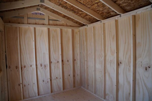 Interior view of the Tackroom Style 8x12 storage shed, showing the wooden walls.