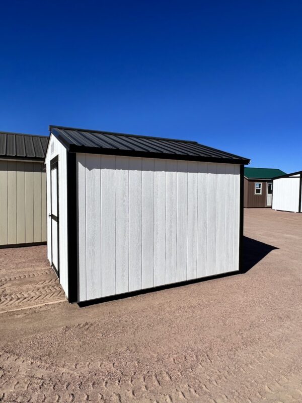 A right side view of the 8x10 Chicken Coop featuring white walls and sleek black trim. A stylish and functional sanctuary for your feathered friends, designed to complement any backyard with its timeless appeal.