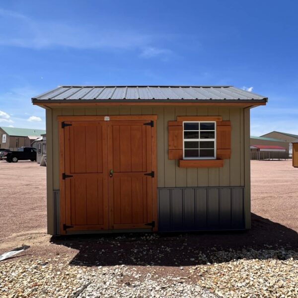 8x12 Tackroom Style storage shed with double doors and a window on the side, viewed from the front.