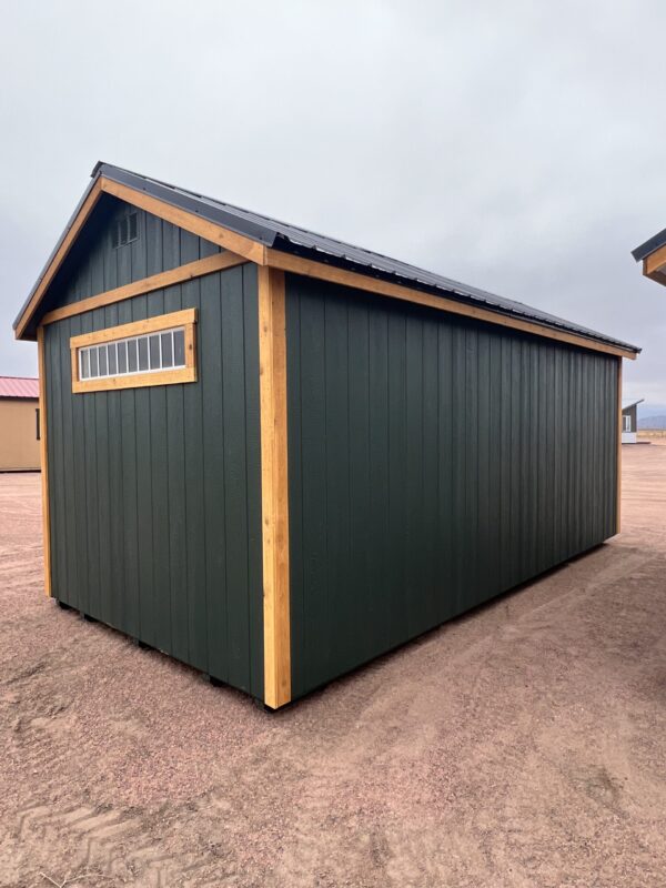 The sky stretches above a shed-like building in an outdoor setting.
