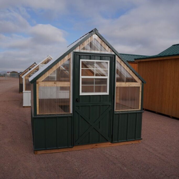 Front view of an 8x8 Green House with wood frame, metal siding, and plastic covering on the upper walls